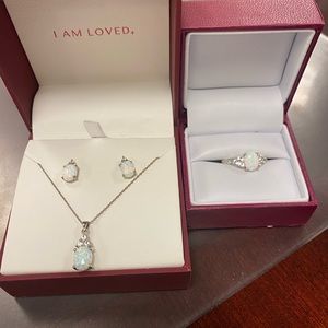 Lab-created oval opal and white sapphire set in sterling silver.